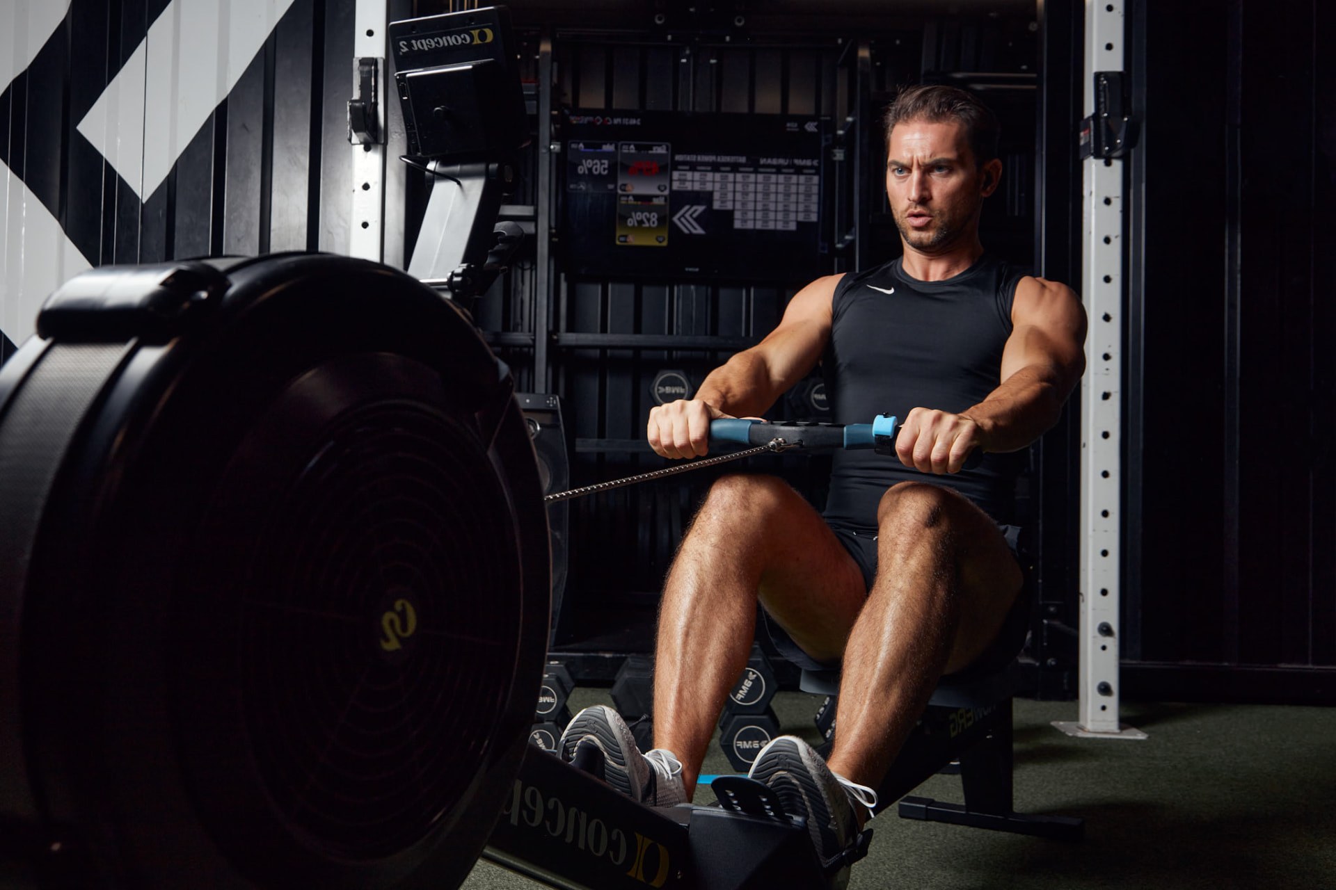 Rower using the ArcX controller mounted on a rowing machine handle